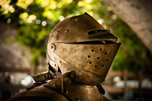 The helmet and shoulder piece of a medieval knights armor The helmet and shoulder piece of a medieval knights armor