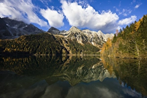 The high mountains of the Rieserferner Alps are reflecting in the Antholzer See (lake antholz) The high mountains of the Rieserferner Alps are reflecting in the Antholzer See (lake antholz)