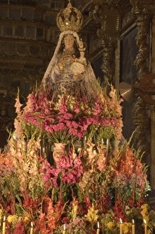 Huge display of flowers and candles under statue of Virgin Purificada, Church of Santa Clara Huge display of flowers and candles under statue of Virgin Purificada, Church of Santa Clara