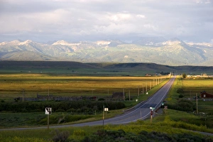 Idaho Highway 33 in Teton County with Teton Mountains near sunset looking east Idaho Highway 33 in Teton County with Teton Mountains near sunset looking east