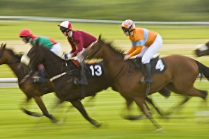 Ireland, County Mayo, Ballinrobe. Jockeys race their horses around the track Ireland, County Mayo, Ballinrobe. Jockeys race their horses around the track