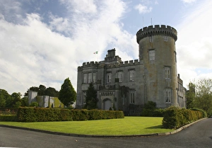 In Ireland, the Dromoland Castle side entrance and turret blue sky white clouds In Ireland, the Dromoland Castle side entrance and turret blue sky white clouds