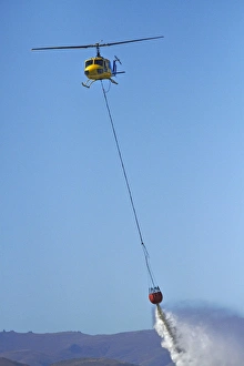 Iroquois Helicopter with monsoon bucket, Warbirds over Wanaka Airshow, Wanaka, South Island Iroquois Helicopter with monsoon bucket, Warbirds over Wanaka Airshow, Wanaka, South Island