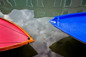 Italy, Burano. Colorful boat bows and reflections Italy, Burano. Colorful boat bows and reflections
