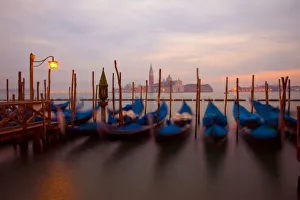 Italy, Venice. Anchored gondolas at twilight. Credit as: Jim Zuckerman / Jaynes Gallery Italy, Venice. Anchored gondolas at twilight. Credit as: Jim Zuckerman / Jaynes Gallery