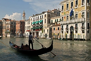 Italy, Venice. Tourists ride in a gondola on the Grand Canal of Venice Italy, Venice. Tourists ride in a gondola on the Grand Canal of Venice