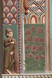 Jaipur, Rajasthan, India. City Palace. Wood carved wall with Lotus flowers, painted decorations Jaipur, Rajasthan, India. City Palace. Wood carved wall with Lotus flowers, painted decorations