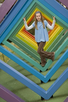 Japan, Kanagawa prefecture, Hakone, Open Air Museum, girl (age 10) climbing on rainbow sculpture Japan, Kanagawa prefecture, Hakone, Open Air Museum, girl (age 10) climbing on rainbow sculpture