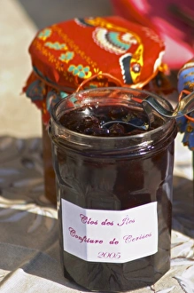 Jars pots of marmelade jam confiture of fruits and berries covered with colourful Jars pots of marmelade jam confiture of fruits and berries covered with colourful