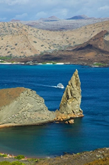 Landscape of island and yachts on ocean, Santiago, Galapagos Islands, Ecuador Landscape of island and yachts on ocean, Santiago, Galapagos Islands, Ecuador