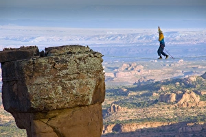 Larry Harpe highlining (slacklining) between Navaho Sandstone Towers on BLM land near Moab Larry Harpe highlining (slacklining) between Navaho Sandstone Towers on BLM land near Moab