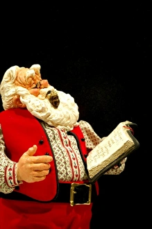 Still life. Simpich Caracter Doll, Santa reading book. Property released Still life. Simpich Caracter Doll, Santa reading book. Property released