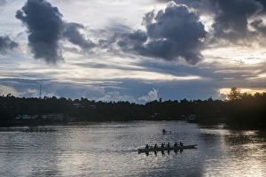 Local people training for the rowing championship in the island of Yap at sunset Local people training for the rowing championship in the island of Yap at sunset