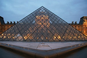 Louvre Museum. Facade of the building and glass pyramid designed by the architect Leo Ming Pei Louvre Museum. Facade of the building and glass pyramid designed by the architect Leo Ming Pei