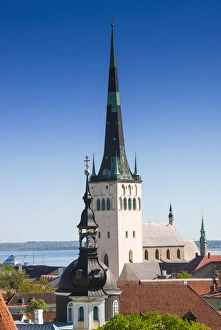 Medieval town walls and spire of St. Olav church, view of Tallinn from Toompea hill Medieval town walls and spire of St. Olav church, view of Tallinn from Toompea hill