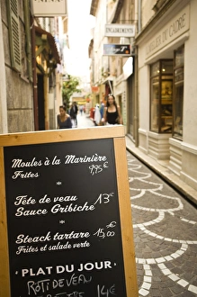 Menu sign on colorful street area of Antibes, France Menu sign on colorful street area of Antibes, France