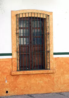 Images Dated 5th December 2004: Mexico, Cabo San Lucas. Detail of colorful wooden window with decorative wrought iron bars