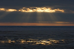 midnight sun over spring breakup of ice south of Barrow, National Petroleum Reserves midnight sun over spring breakup of ice south of Barrow, National Petroleum Reserves
