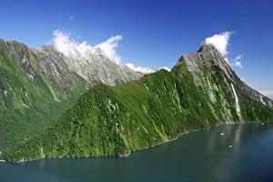 Milford Sound, New Zealand. The majestic fjords, waterfalls, and imposing mountaintops Milford Sound, New Zealand. The majestic fjords, waterfalls, and imposing mountaintops