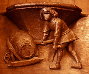 Misericord from Beauvais. Cooper. Barrel on a wheel-barrow. 15th cent Misericord from Beauvais. Cooper. Barrel on a wheel-barrow. 15th cent