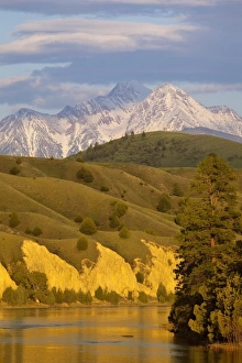 Mission Mountains loom over the Flathead River in Mission Valley, Montana, USA Mission Mountains loom over the Flathead River in Mission Valley, Montana, USA