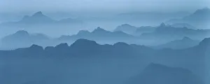 Misty blue ridges retreat into the mist in the Cascade Mountains Misty blue ridges retreat into the mist in the Cascade Mountains