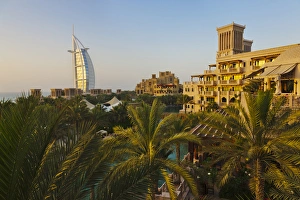 Modern Burj Al Arab Hotel and traditional wind house, Dubai, United Arab Emirates Modern Burj Al Arab Hotel and traditional wind house, Dubai, United Arab Emirates