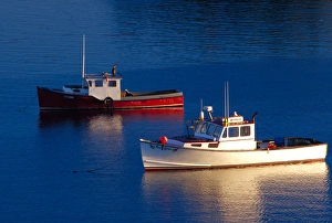NA, USA, Maine. Lobster boats out at sunset in Lubec NA, USA, Maine. Lobster boats out at sunset in Lubec