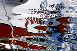 North America, USA, Florida, Titusville, reflection of a red, white and blue sailboat North America, USA, Florida, Titusville, reflection of a red, white and blue sailboat