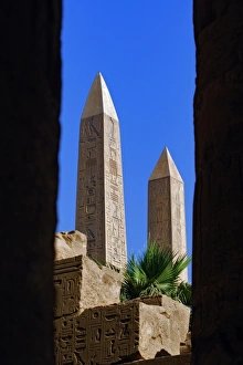 The two Obelisks of Queen Hatshepsut viewed between columns of the Hypostyle Hall The two Obelisks of Queen Hatshepsut viewed between columns of the Hypostyle Hall