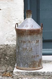 An old tin jar for transporting olive oil Crousnillon Huiles. Moulin Mas des Barres olive mill An old tin jar for transporting olive oil Crousnillon Huiles. Moulin Mas des Barres olive mill