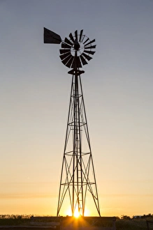 Old windmill at sunset near New England, North Dakota, USA Old windmill at sunset near New England, North Dakota, USA
