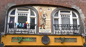 An ornate building decorated with a mosaic of tiles of Christiaan Huygens, the Dutch An ornate building decorated with a mosaic of tiles of Christiaan Huygens, the Dutch