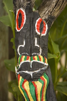 Painted face on driftwood, Placencia, Stann Creek District, Belize, Central America Painted face on driftwood, Placencia, Stann Creek District, Belize, Central America
