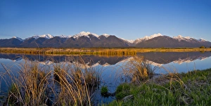 Panoramic of wetlands pond reflecting the Mission Mountain Range at Ninepipe WMA near Ronan Panoramic of wetlands pond reflecting the Mission Mountain Range at Ninepipe WMA near Ronan