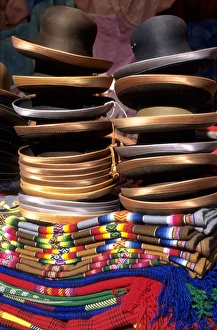 Peru. Pile of felt hats with satin rims on a pile of woven mantas Peru. Pile of felt hats with satin rims on a pile of woven mantas
