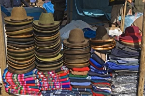 Peru, Pisac, Hats and clothes for sale at market Peru, Pisac, Hats and clothes for sale at market