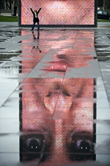 A photo of the Crown Fountain reflecting in puddles from recent rain in Chicago's A photo of the Crown Fountain reflecting in puddles from recent rain in Chicago's