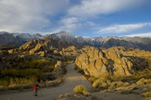 Photographer in the Roadway Alabama Hills California with a backdrop of the Eastern Photographer in the Roadway Alabama Hills California with a backdrop of the Eastern