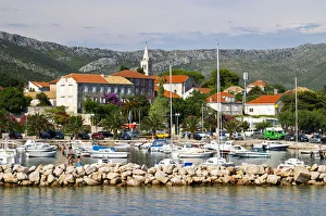 The pleasure boat harbour and the village. Orebic town, holiday resort on the south The pleasure boat harbour and the village. Orebic town, holiday resort on the south