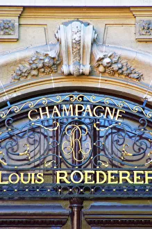 The portico in wrought iron on entrance door to Champagne Louis Roederer, Reims The portico in wrought iron on entrance door to Champagne Louis Roederer, Reims