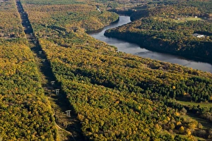Power lines cut a swath through the forest next to the Connecticut River in Gill Power lines cut a swath through the forest next to the Connecticut River in Gill