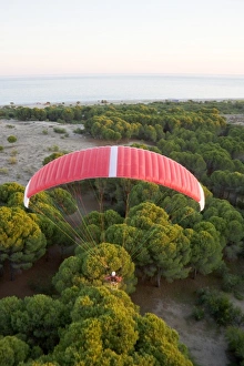 Powered paraglider flying over maquis shrubland in Demre, aerial view, Antalya, Turkey Powered paraglider flying over maquis shrubland in Demre, aerial view, Antalya, Turkey