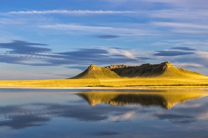 Priest Butte reflects into wetlands pond at Freezeout Lake WMA near Choteau, Montana, USA Priest Butte reflects into wetlands pond at Freezeout Lake WMA near Choteau, Montana, USA