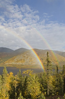 A rainbow arcs over autumn colors and Grayling Lake along the James Dalton Highway A rainbow arcs over autumn colors and Grayling Lake along the James Dalton Highway