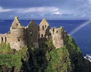 Historic Sites In Europe Prints: A rainbow strikes medieval Dunluce Castle on the Antrim Coast in Co
