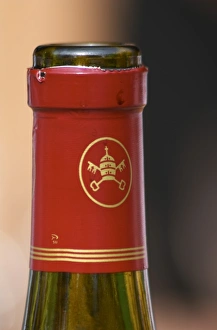 Red chateauneuf bottle with the logo symbol of the appellation, the popes hat and keys Red chateauneuf bottle with the logo symbol of the appellation, the popes hat and keys
