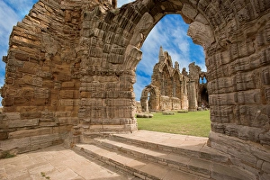 The Ruins of Whitby Abbey above the town and harbor of Whitby on the North Yorkshire The Ruins of Whitby Abbey above the town and harbor of Whitby on the North Yorkshire
