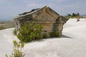 Sarcophagus embedded in white travertine rocks of Pamukkale (ancient Hierapolis), Turkey Sarcophagus embedded in white travertine rocks of Pamukkale (ancient Hierapolis), Turkey