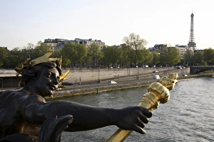 The sculpture on the Pont Alexandre III with River Seine The sculpture on the Pont Alexandre III with River Seine
